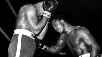 Joe Frazier battles Muhammad Ali in 1971.